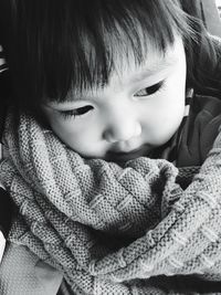 Close-up of cute baby girl in warm clothing