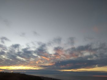 Low angle view of dramatic sky during sunset