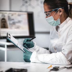 Female scientist working at crime laboratory