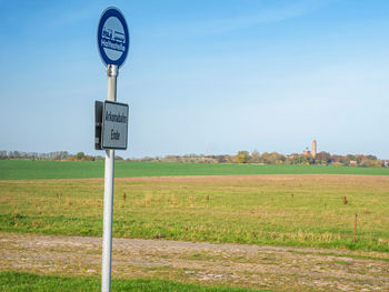 Info plate kap arkona at road for tourists and tour. landscape with cape arkona lighthouse at baltic