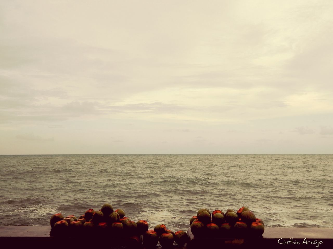 SCENIC VIEW OF SEA WITH ROCKS IN BACKGROUND