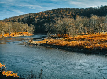 Scenic view of lake against sky during autumn