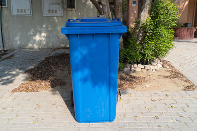 Blue chair on footpath