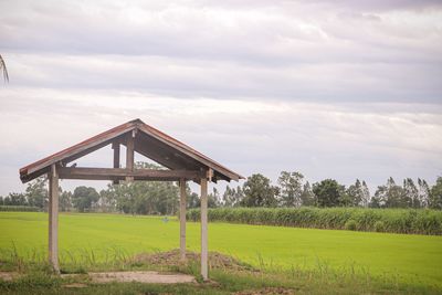 Gazebo on field against sky