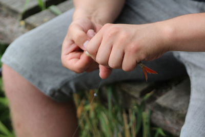 Close-up of boy holding hands