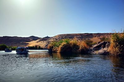 Scenic view of river against clear sky