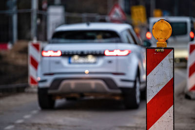 Evening traffic jam during road repairs, ntense traffic flow of in cars rush hours, rear viev