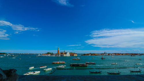 Boats moored at harbor