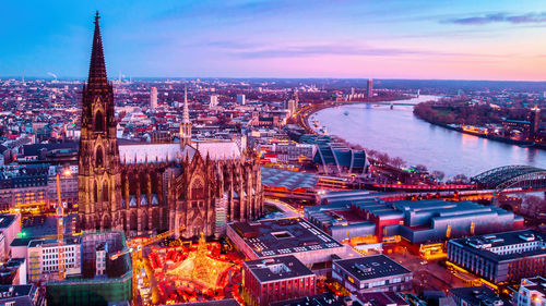 High angle view of illuminated buildings in city