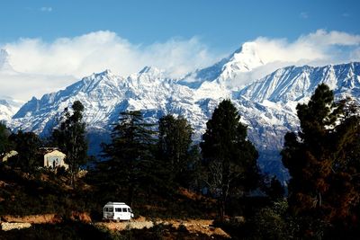 Scenic view of snowcapped mountains against sky