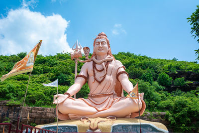 Hindu god shiva sculpture sitting in meditation. yoga and meditation concept.