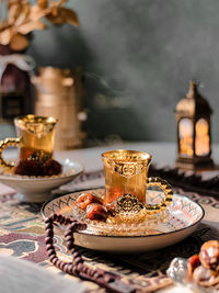 A glass of hot tea served with dates fruits in middle east vibes