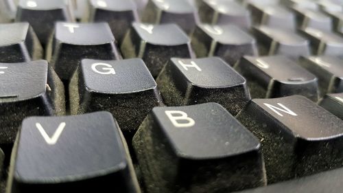 Full frame shot of dusty computer keyboard