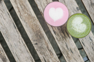 Directly above shot of matcha coffee cups on table