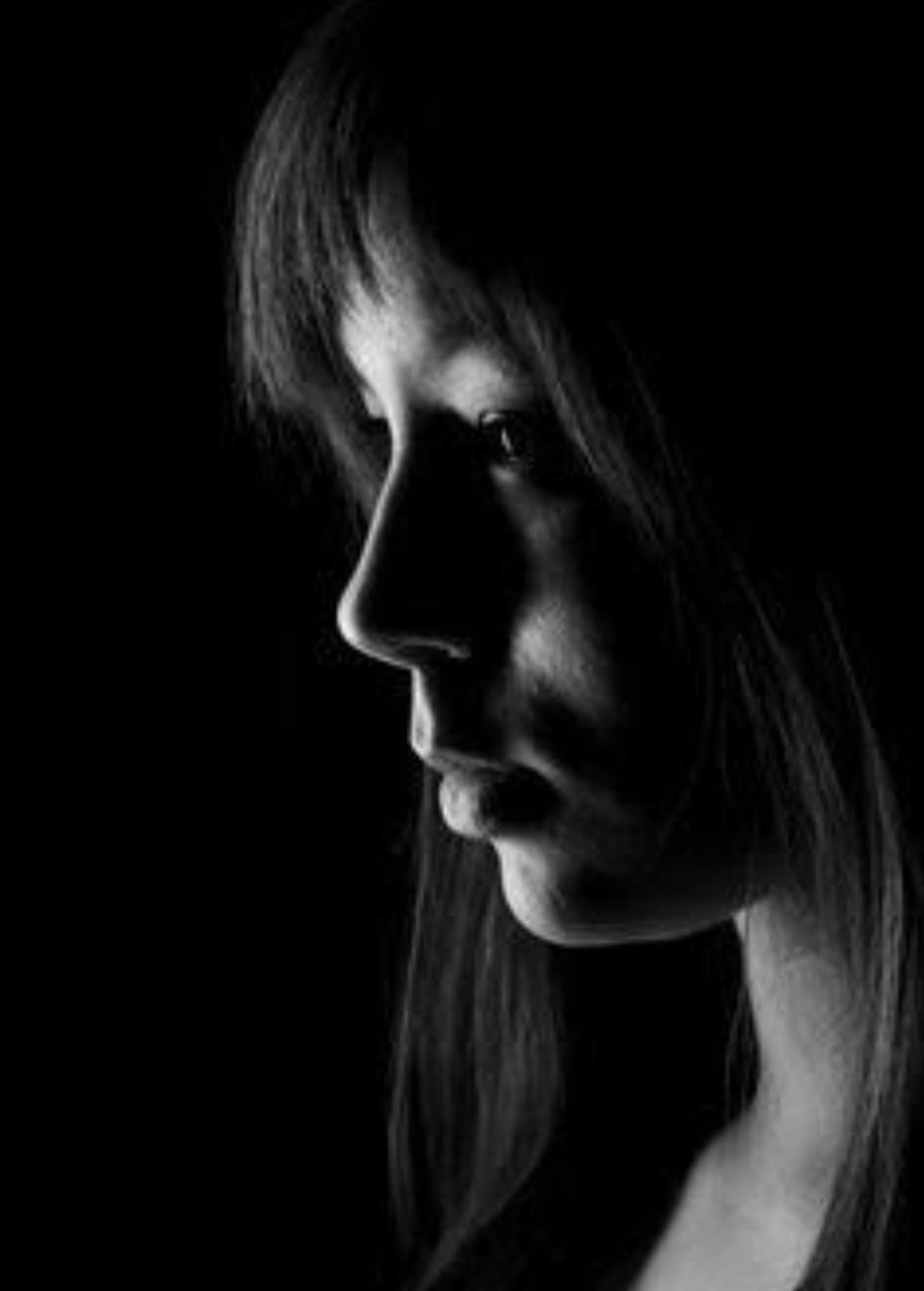 black background, portrait, one person, headshot, emotion, studio shot, indoors, adult, looking, women, sadness, fear, young adult, spooky, dark, close-up, horror, body part, aggression, depression - sadness, contemplation, human face, hairstyle, profile view, teenager