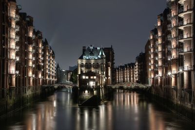 Illuminated buildings in city at night