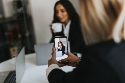 Young woman using mobile phone