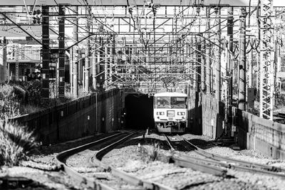 Train on railroad tracks by building