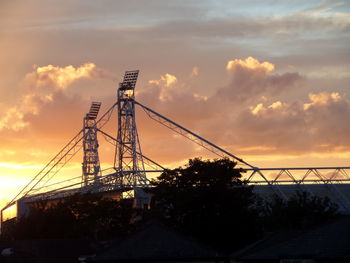 Ferris wheel against dramatic sky