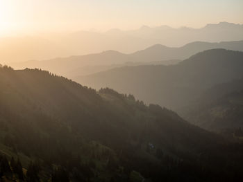 Scenic view of mountains against sky during sunset