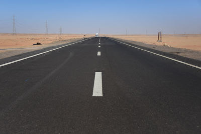 Truck driving along desert road