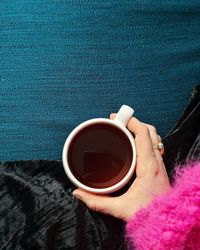 Woman holding coffee cup