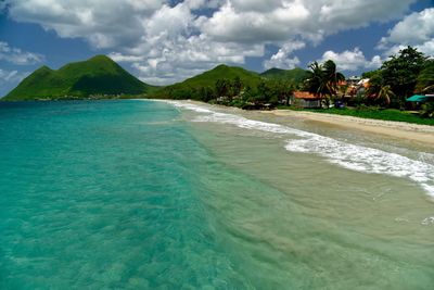 High angle view of coastline cloudy sky