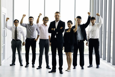 Group of people standing against wall