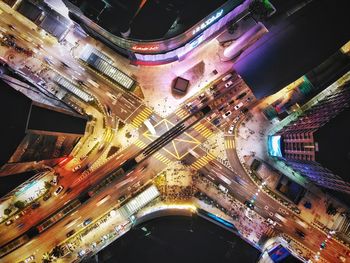 High angle view of illuminated buildings in city at night