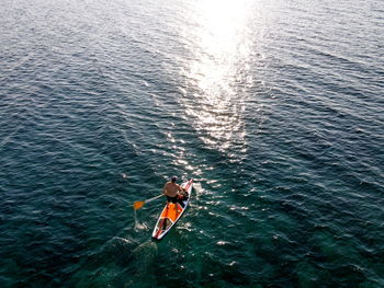 High angle view of people on boat in sea