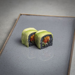 Close-up of sushi in plate on floor