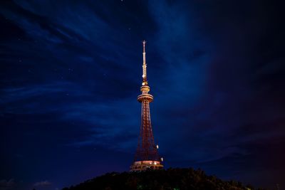 Low angle view of tower at night