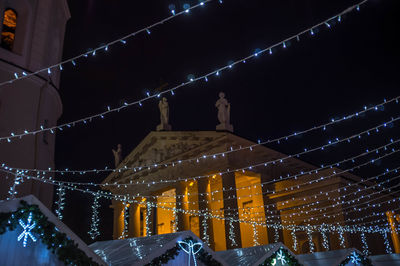 Low angle view of illuminated christmas tree at night