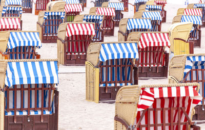 Hooded beach chairs on the beach of travemuende, germany