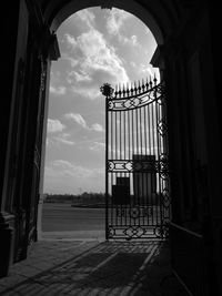 Entrance gate of historic building against sky