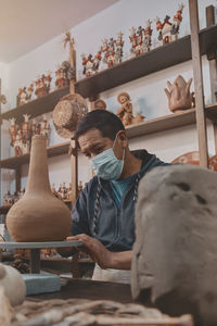 Artisan working in his workshop, ayacucho peru