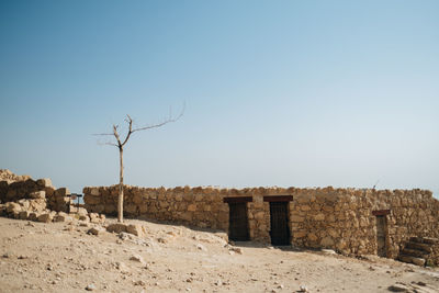 Scenic view of arid landscape against clear sky