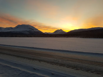 Scenic view of mountains against sky during sunset