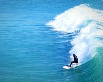 People surfing in sea