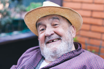 Smiling elderly man with missing tooth