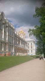 Buildings against cloudy sky