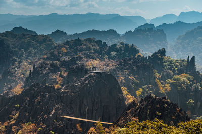 High angle view of trees and mountains against sky