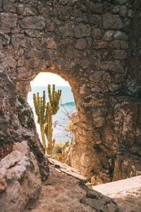 Stone wall by rock formation