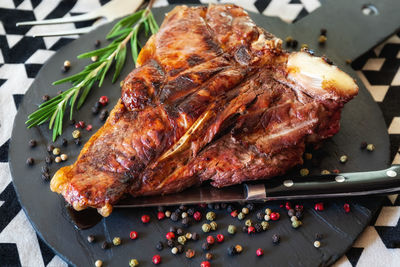 High angle view of meat on barbecue grill