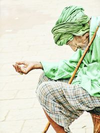 Senior man sitting outdoors