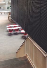 Red umbrella on bridge in city