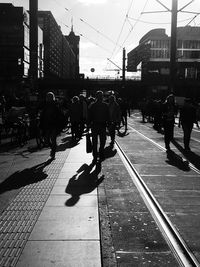 People walking on street in city