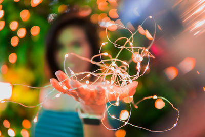 Close-up of illuminated christmas lights at night