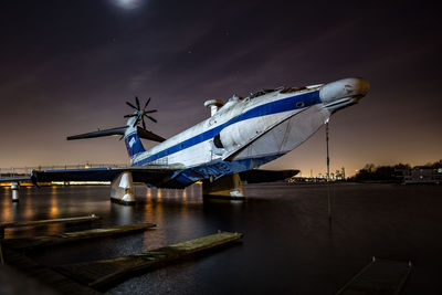 Ekranoplan against sky at night