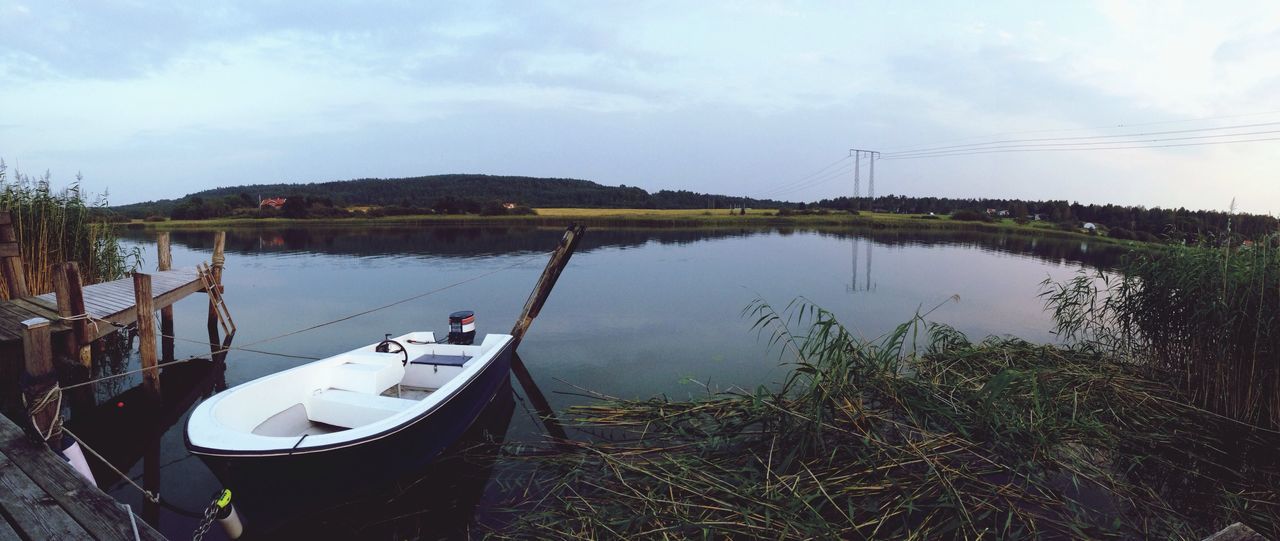 nautical vessel, water, boat, moored, transportation, mode of transport, sky, lake, reflection, tranquility, nature, tranquil scene, cloud - sky, day, mast, beauty in nature, river, scenics, tree, cloud